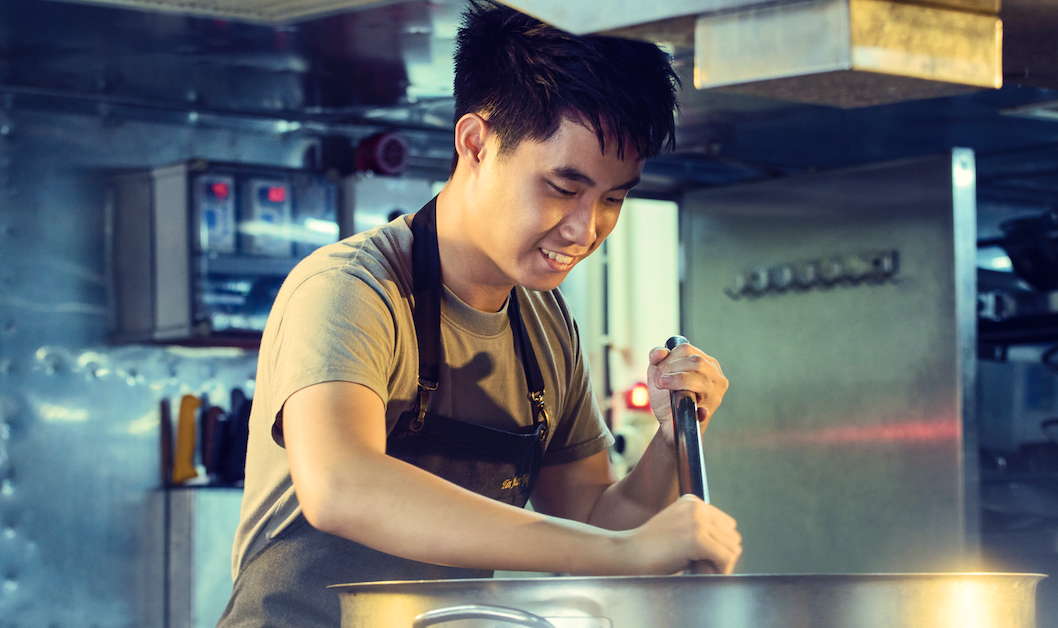 RSN chef in uniform preparing meals